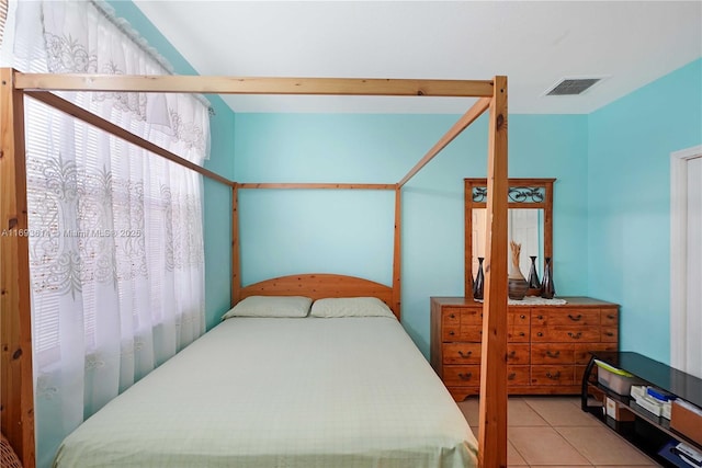 bedroom with light tile patterned flooring