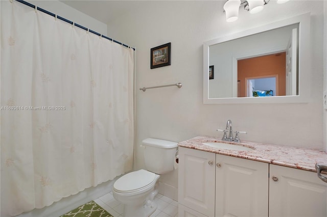 bathroom featuring tile patterned floors, vanity, and toilet