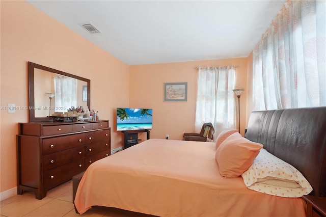 bedroom featuring light tile patterned floors