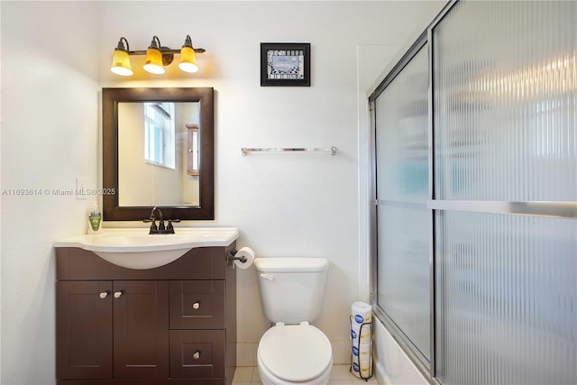 full bathroom with vanity, toilet, and enclosed tub / shower combo