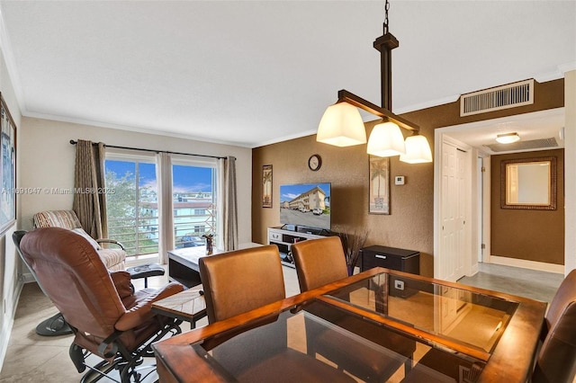 dining space featuring ornamental molding