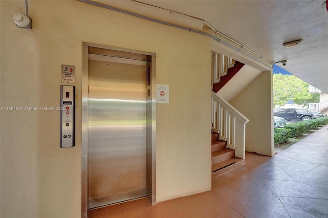 staircase featuring elevator