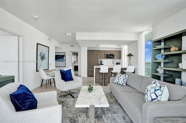 living room with light tile patterned flooring