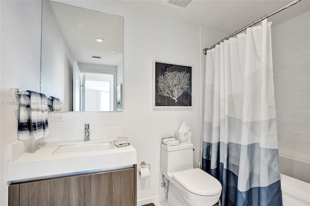 full bathroom featuring vanity, toilet, and shower / tub combo