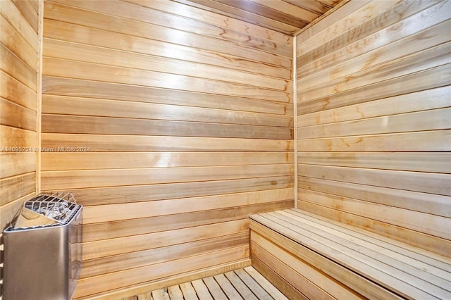 view of sauna / steam room featuring wood walls