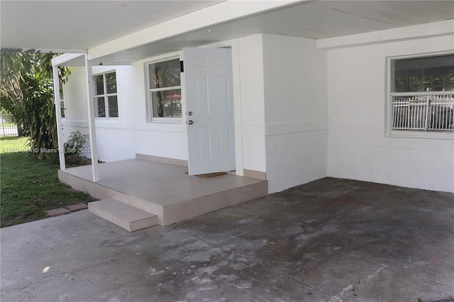 doorway to property with a patio area