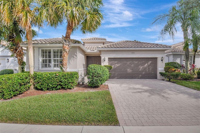 mediterranean / spanish-style home featuring a garage