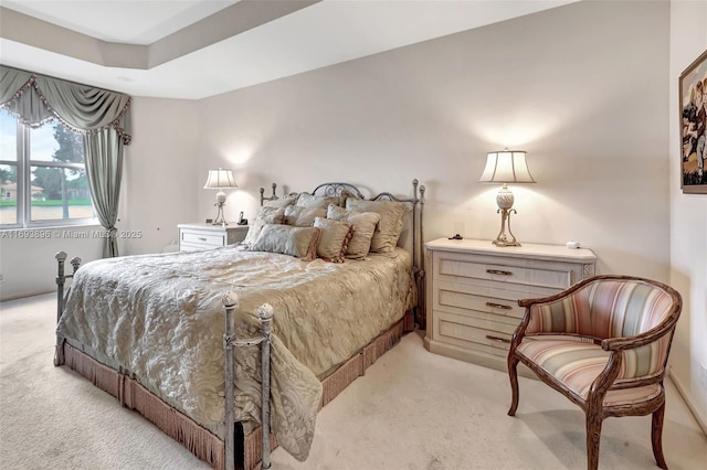 bedroom featuring light carpet