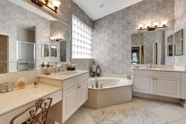 bathroom featuring tile patterned floors, vanity, and independent shower and bath