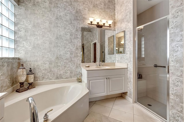 bathroom featuring vanity, tile patterned floors, and separate shower and tub