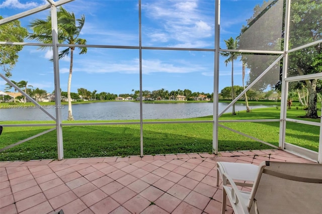 unfurnished sunroom with a water view