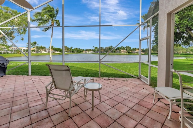 unfurnished sunroom featuring a water view