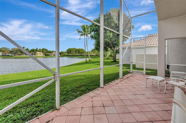 unfurnished sunroom featuring a water view