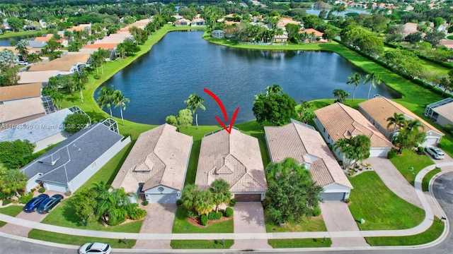 birds eye view of property featuring a water view