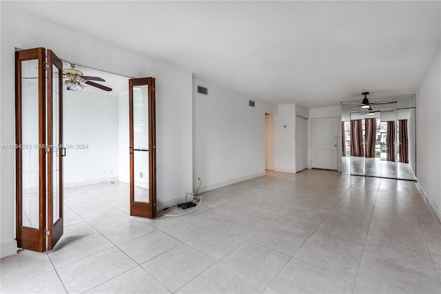 2000 Atlantic Shores Blvd Unit 107, Hallandale Beach, FL 33009 - empty room with ceiling fan, light tile patterned floors, and baseboards