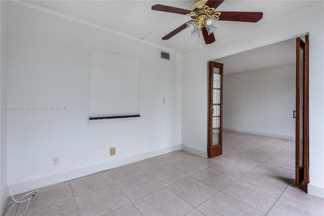 2000 Atlantic Shores Blvd Unit 107, Hallandale Beach, FL 33009 - empty room with a ceiling fan, light tile patterned floors, and baseboards