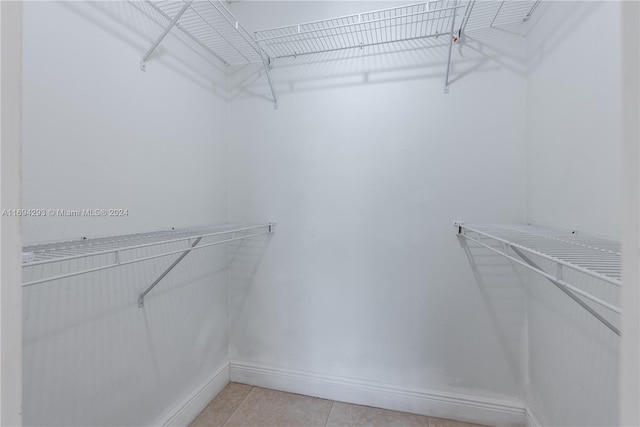 2000 Atlantic Shores Blvd Unit 107, Hallandale Beach, FL 33009 - walk in closet featuring light tile patterned floors
