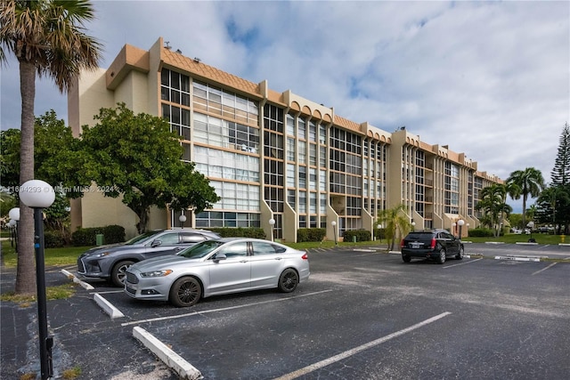 2000 Atlantic Shores Blvd Unit 107, Hallandale Beach, FL 33009 - view of apartment building / complex featuring uncovered parking