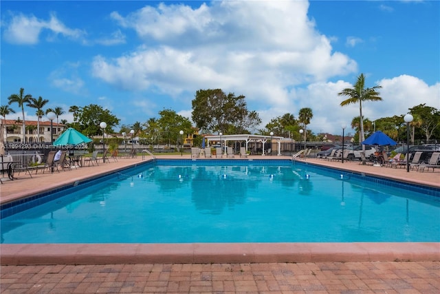 2000 Atlantic Shores Blvd Unit 107, Hallandale Beach, FL 33009 - community pool featuring fence and a patio area
