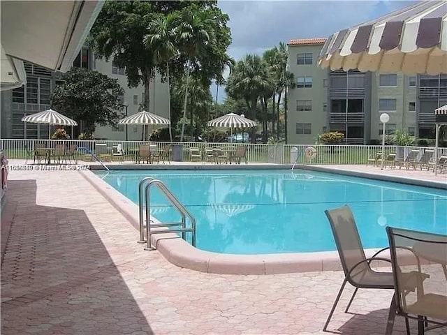 view of swimming pool with a patio area