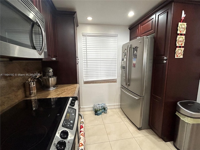 kitchen with light tile patterned floors and appliances with stainless steel finishes