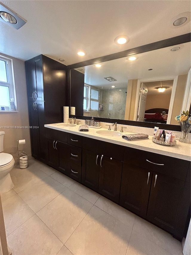 bathroom with vanity, tile patterned floors, walk in shower, and a healthy amount of sunlight