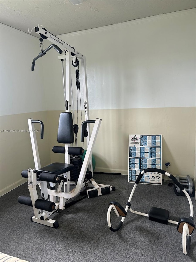 workout area with a textured ceiling