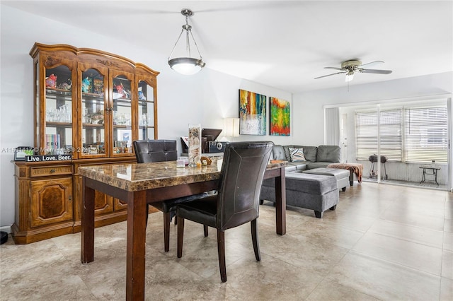 dining space featuring ceiling fan