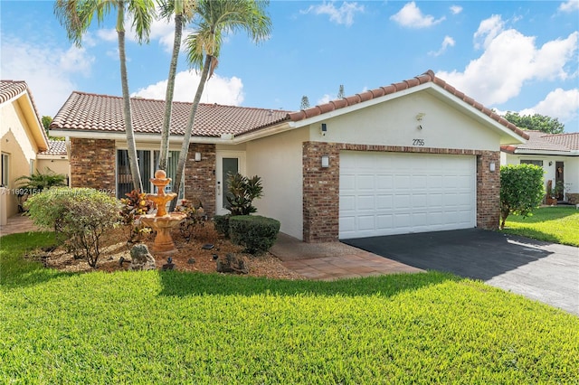 view of front of house featuring a garage and a front yard