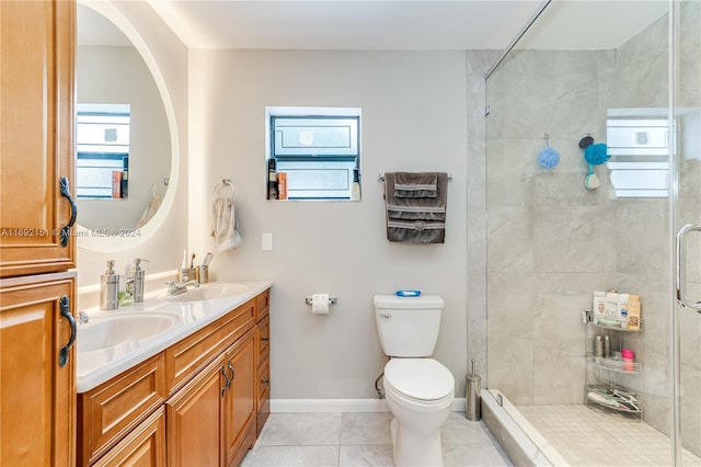 bathroom featuring a tile shower, a wealth of natural light, tile patterned flooring, and toilet