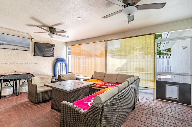 view of patio featuring an outdoor living space and ceiling fan