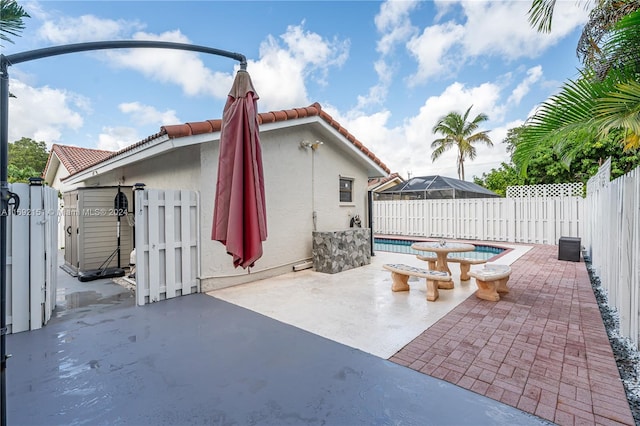 view of patio featuring a fenced in pool