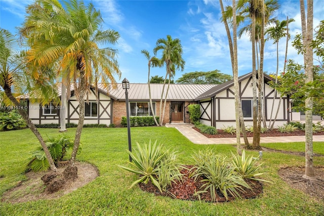 tudor home with a front yard