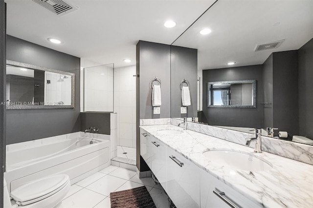 full bathroom featuring tile patterned floors, vanity, independent shower and bath, and toilet