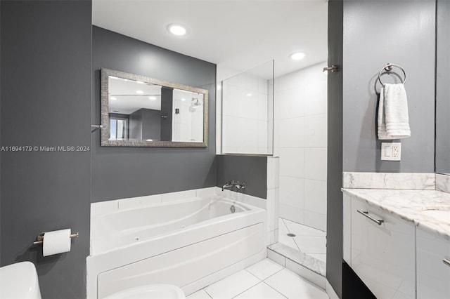 bathroom featuring tile patterned floors, vanity, and plus walk in shower