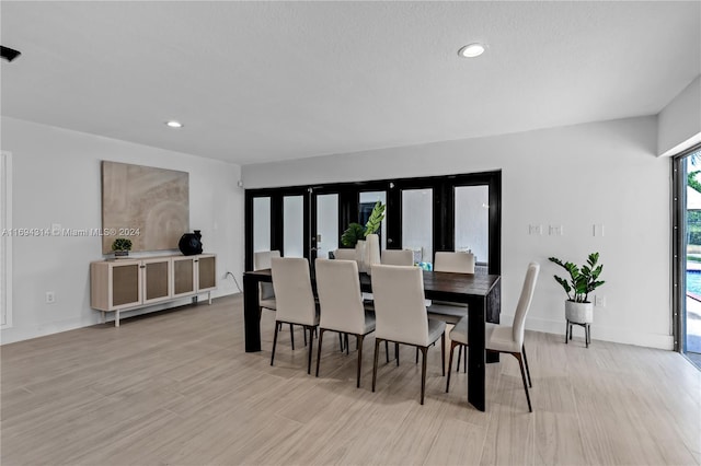 dining space with light wood-type flooring