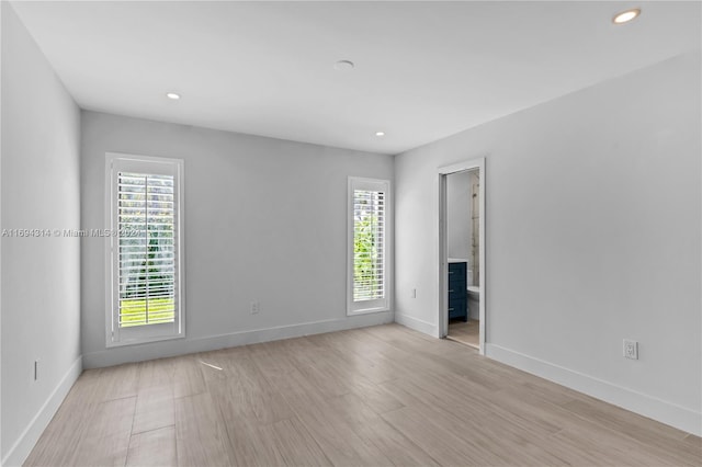 unfurnished room with light hardwood / wood-style flooring