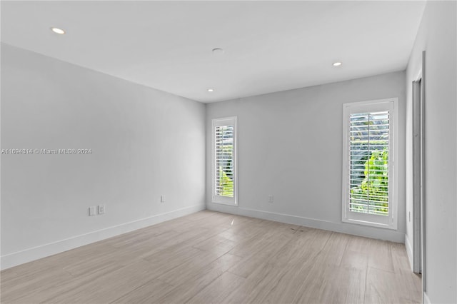 unfurnished room featuring light hardwood / wood-style flooring