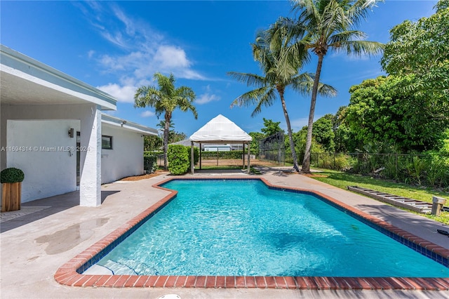 view of pool featuring a gazebo and a patio area