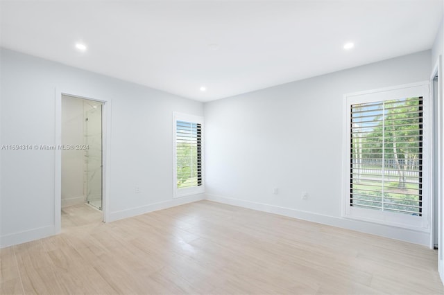 unfurnished room with a healthy amount of sunlight and light wood-type flooring