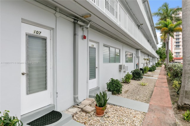 entrance to property with a wall mounted air conditioner