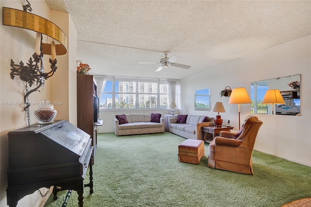 carpeted living room featuring a textured ceiling and ceiling fan