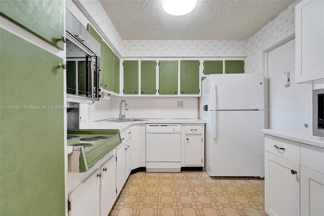 kitchen featuring white cabinets, a textured ceiling, white appliances, and sink