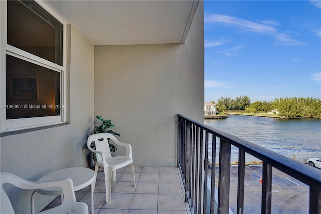 balcony featuring a water view