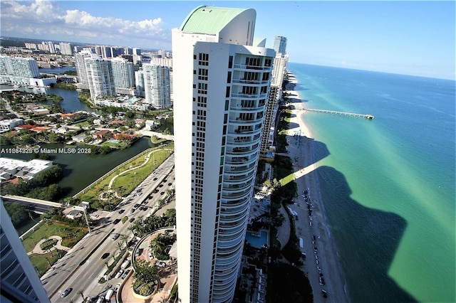 bird's eye view featuring a beach view and a water view