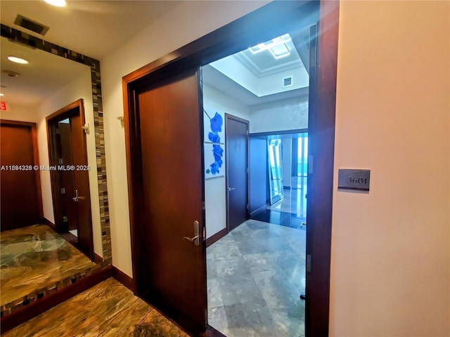 hallway with crown molding