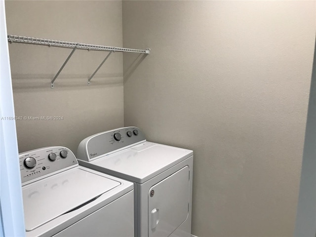 laundry area with washer and clothes dryer