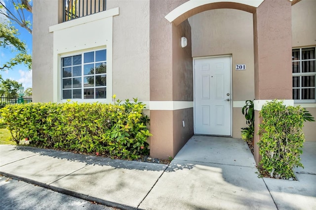 entrance to property with a balcony