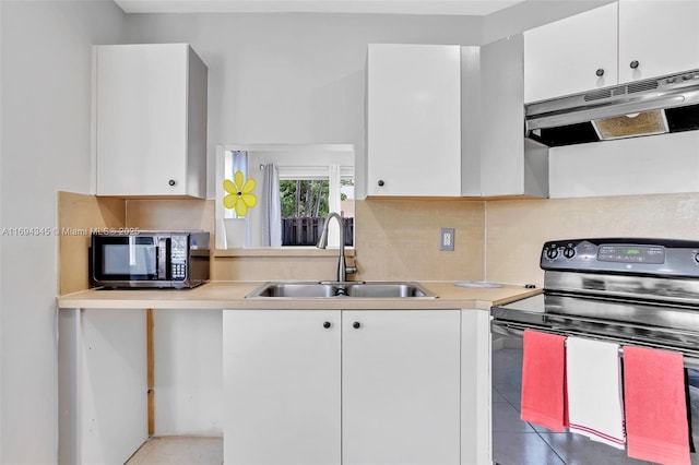 kitchen with white cabinetry, light tile patterned floors, sink, and black appliances