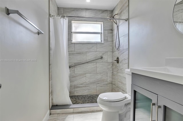 bathroom featuring vanity, a shower with curtain, and toilet